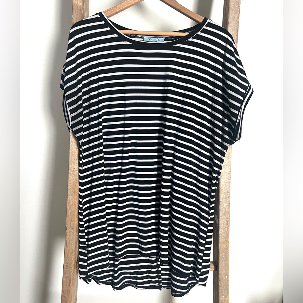 She + Sky black and white short sleeved striped shirt with back slit. Size XL